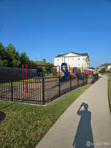 a view of a backyard with sitting area