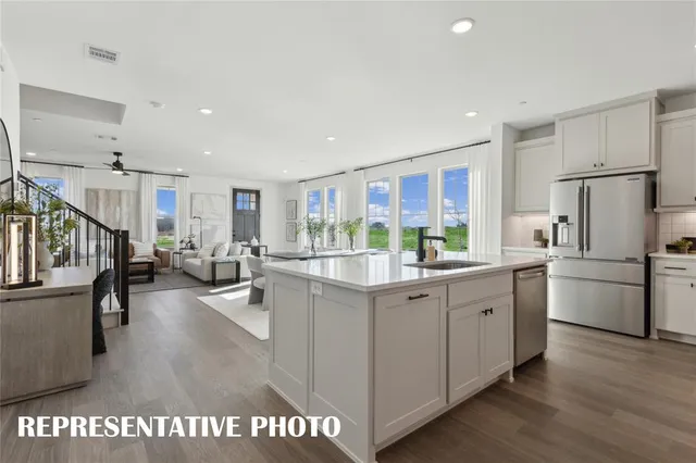 a kitchen with counter top space and stainless steel appliances