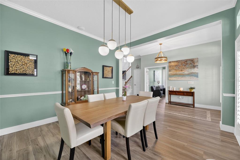 508 Islebay Drive Apollo Beach, FL 33572 - Photo 13 of 98 a view of a dining room with furniture and wooden floor
