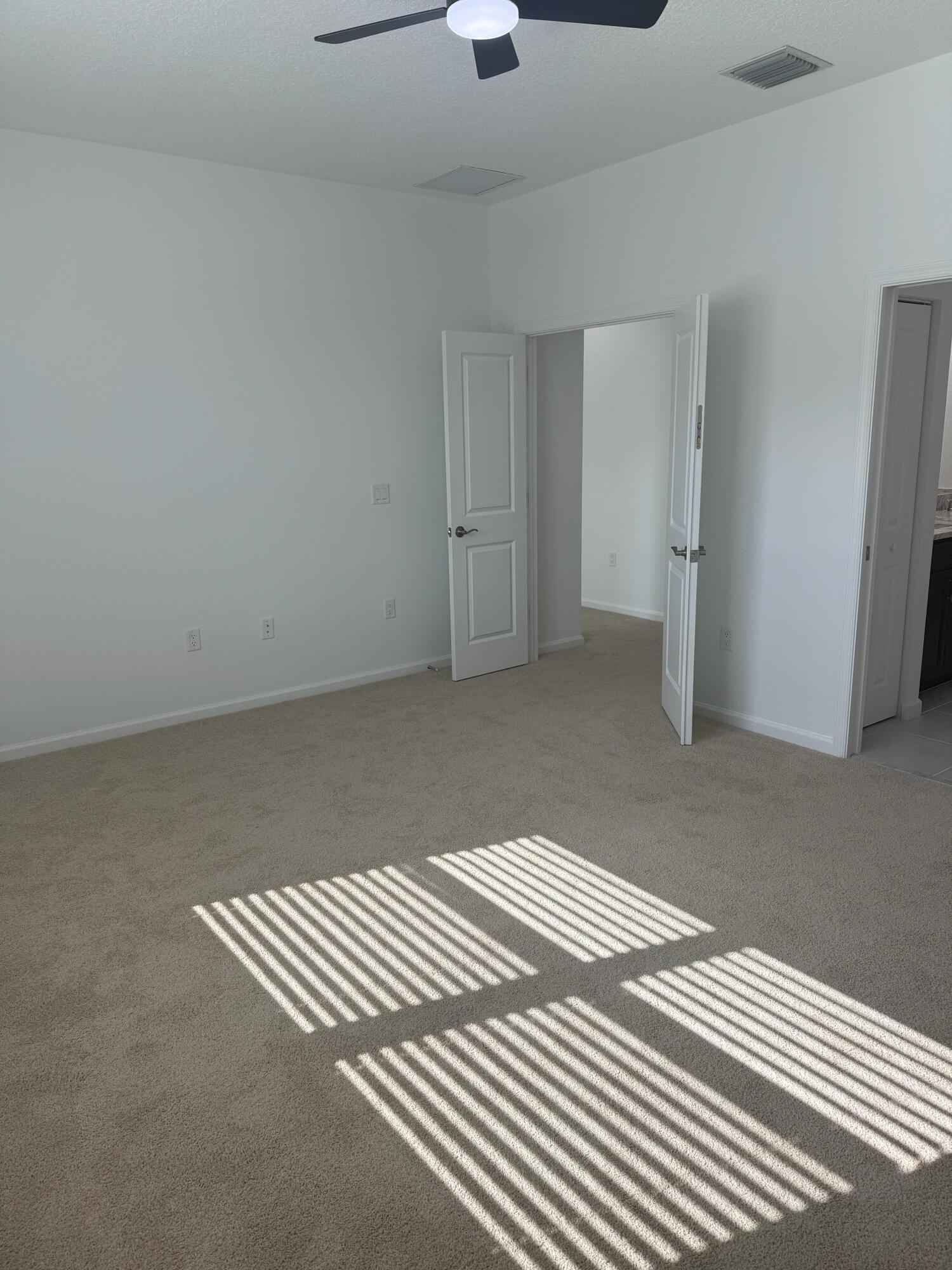 Undisclosed Address Loxahatchee, FL 33470 - Photo 6 of 17 a view of wooden floor and windows in a room