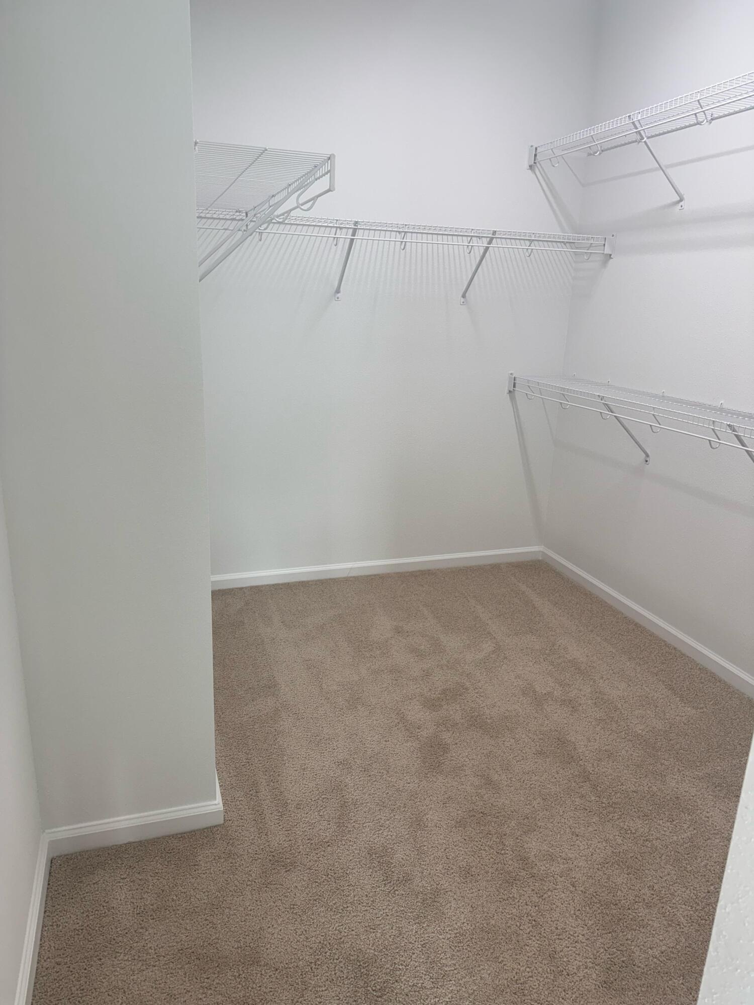 Undisclosed Address Loxahatchee, FL 33470 - Photo 8 of 17 a view of a room with racks on the wall