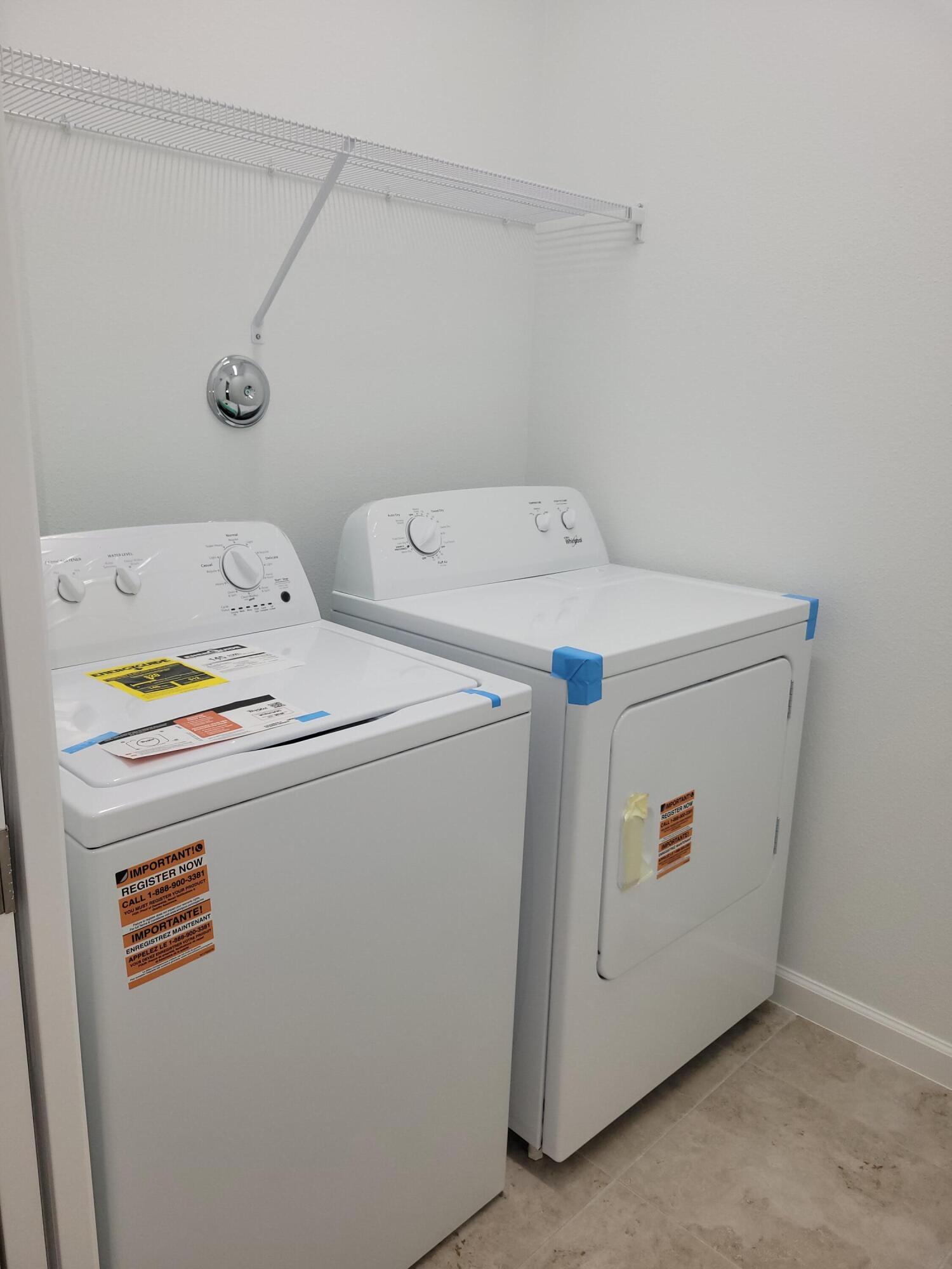 Undisclosed Address Loxahatchee, FL 33470 - Photo 9 of 17 a utility room with dryer and washer