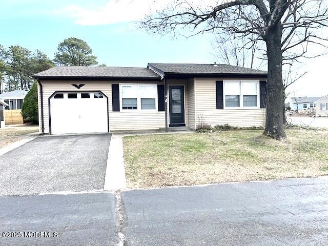 38 Keene Street, Unit 70 Whiting, NJ 08759 - Photo 1 of 10 a view of a house with a big yard and large tree