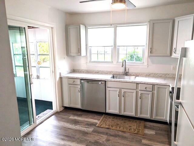 38 Keene Street, Unit 70 Whiting, NJ 08759 - Photo 2 of 10 a kitchen with a sink window and cabinets