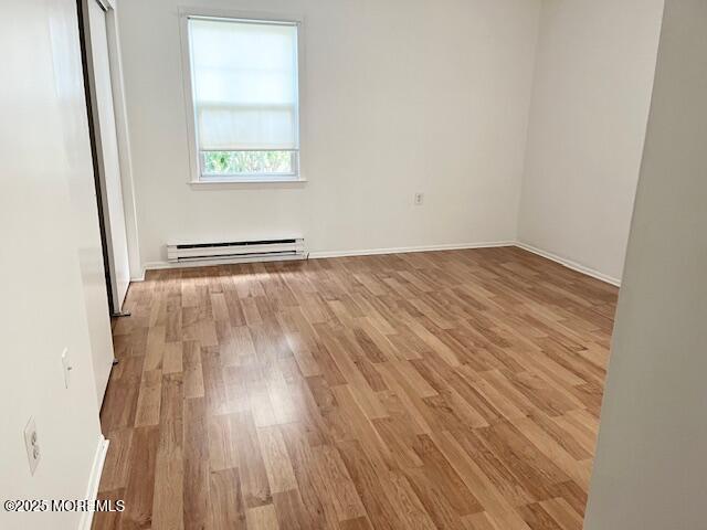 38 Keene Street, Unit 70 Whiting, NJ 08759 - Photo 6 of 10 an empty room with wooden floor and windows