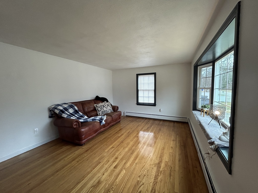 10 Walter Street Norton, MA 02766 - Photo 14 of 33 a living room with furniture and large windows