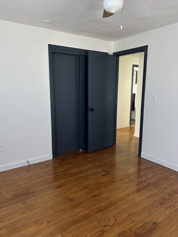 10 Walter Street Norton, MA 02766 - Photo 21 of 33 a view of an empty room with wooden floor and closet