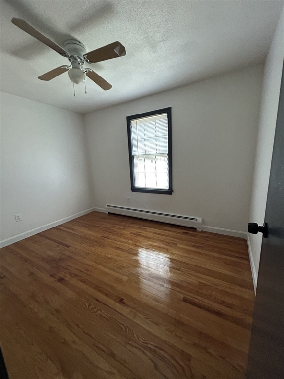 10 Walter Street Norton, MA 02766 - Photo 29 of 33 an empty room with wooden floor and windows
