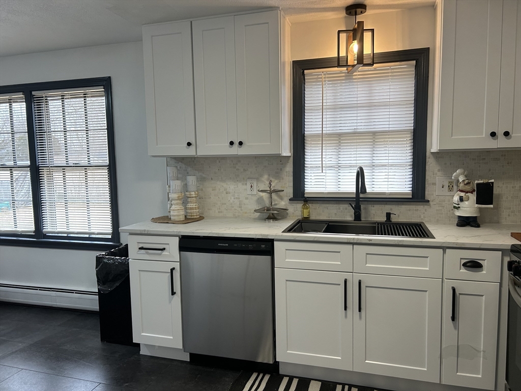 10 Walter Street Norton, MA 02766 - Photo 5 of 33 a kitchen with cabinets appliances a sink and a window