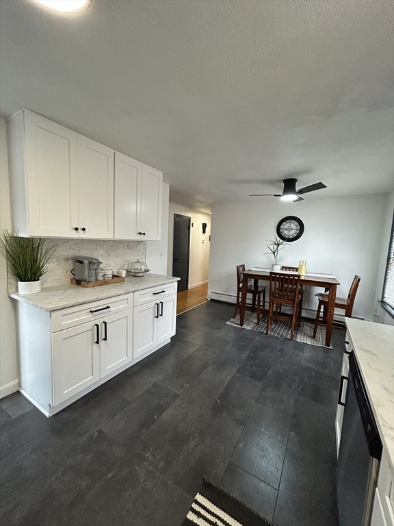 10 Walter Street Norton, MA 02766 - Photo 6 of 33 a kitchen with cabinets and chairs in it