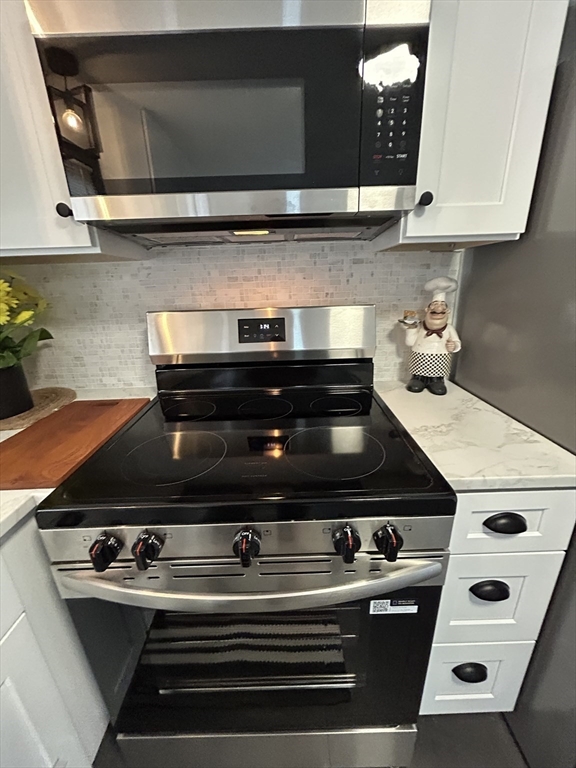10 Walter Street Norton, MA 02766 - Photo 9 of 33 a stove top oven sitting inside of a kitchen