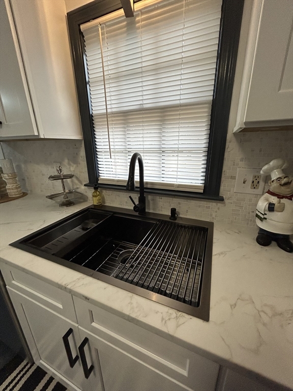 10 Walter Street Norton, MA 02766 - Photo 10 of 33 a kitchen with a sink a stove and a window