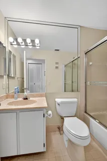 a view of a kitchen with a sink and a window