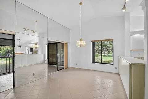 a kitchen with stainless steel appliances granite countertop a refrigerator a sink and a stove