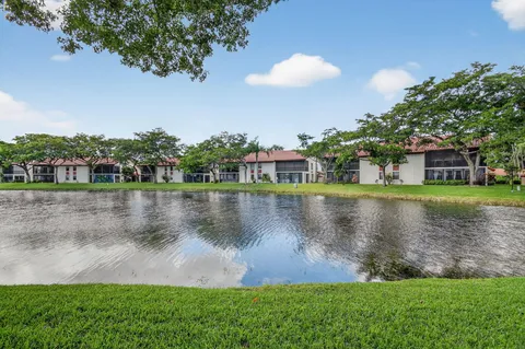 an aerial view of multiple houses with yard