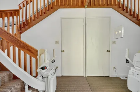 a white toilet sitting next to a bathroom