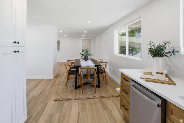 810 East Maple Street Mapleton, UT 84664 - Photo 14 of 49 Open-concept dining and kitchen area featuring wood-finish flooring, recessed lighting, and white walls