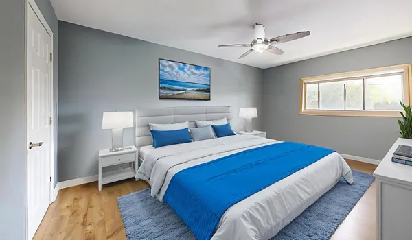 a bedroom with bed and a window