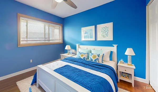 a bedroom with bed and a window