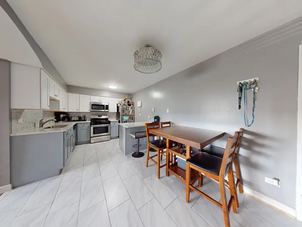 a view of a kitchen and dining room