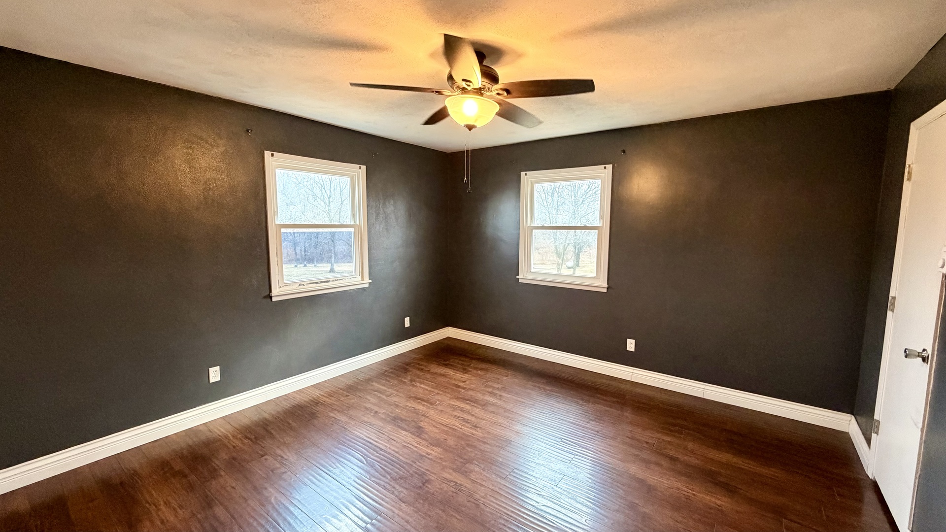 16846 East Payton Road Opdyke, IL 62872 - Photo 11 of 23 a view of an empty room with wooden floor and a window
