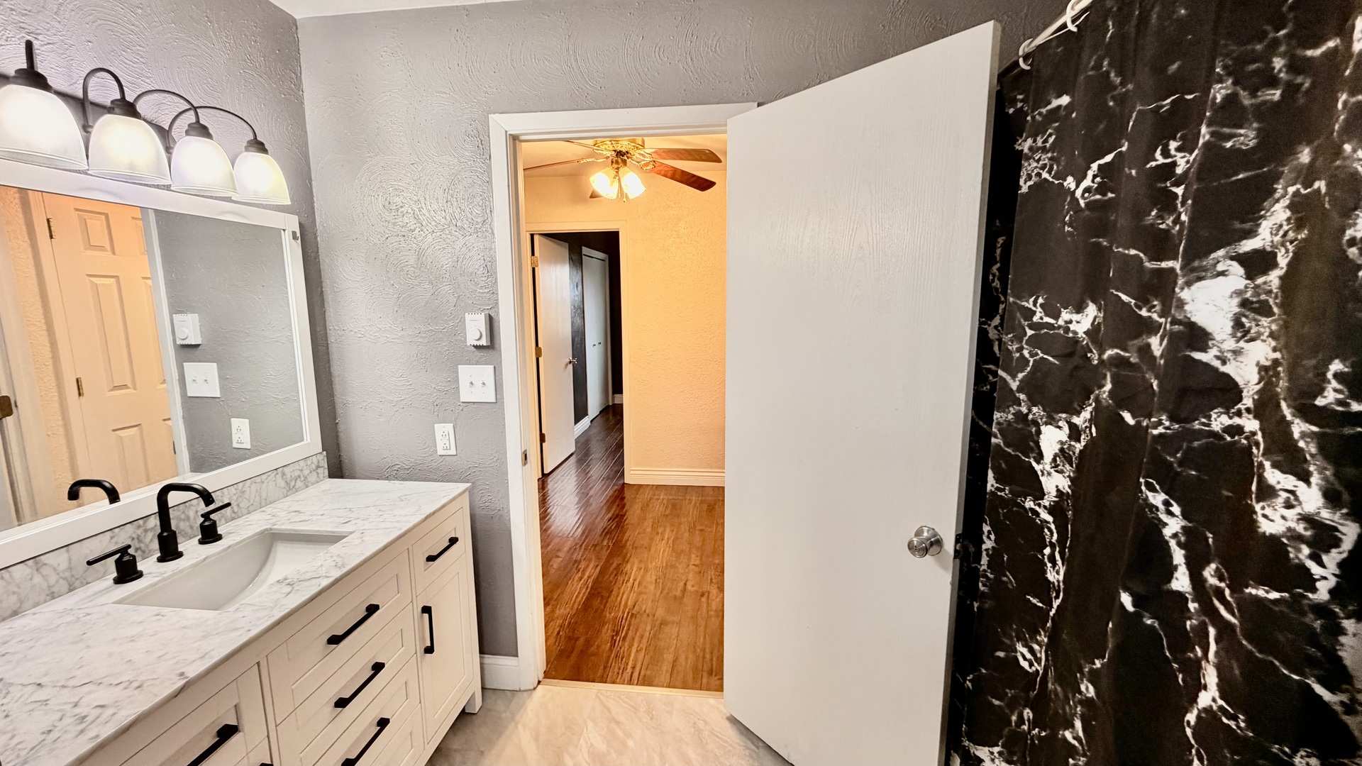 16846 East Payton Road Opdyke, IL 62872 - Photo 15 of 23 a bathroom with a double vanity sink and mirror