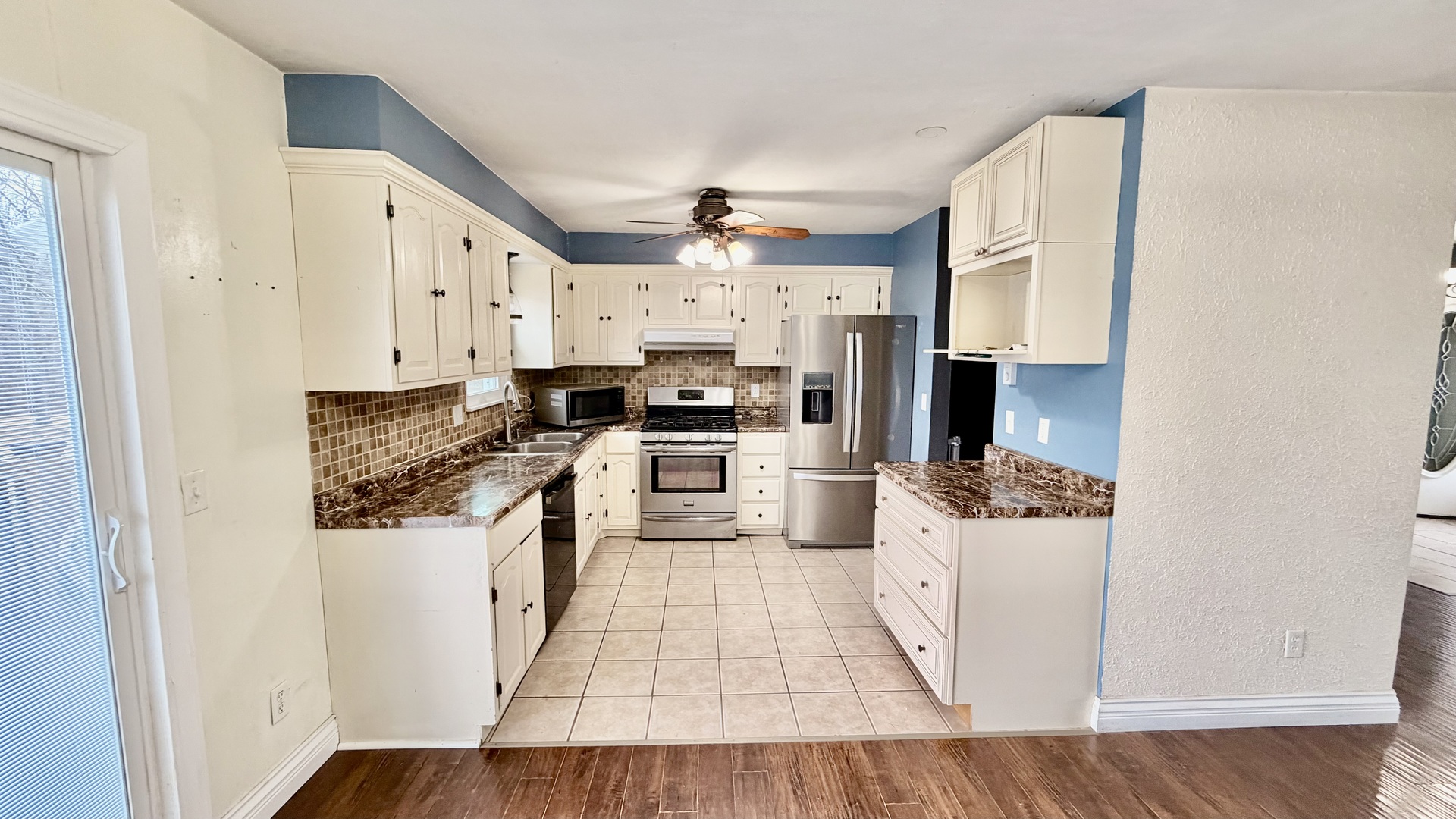 16846 East Payton Road Opdyke, IL 62872 - Photo 9 of 23 a kitchen with white cabinets and appliances