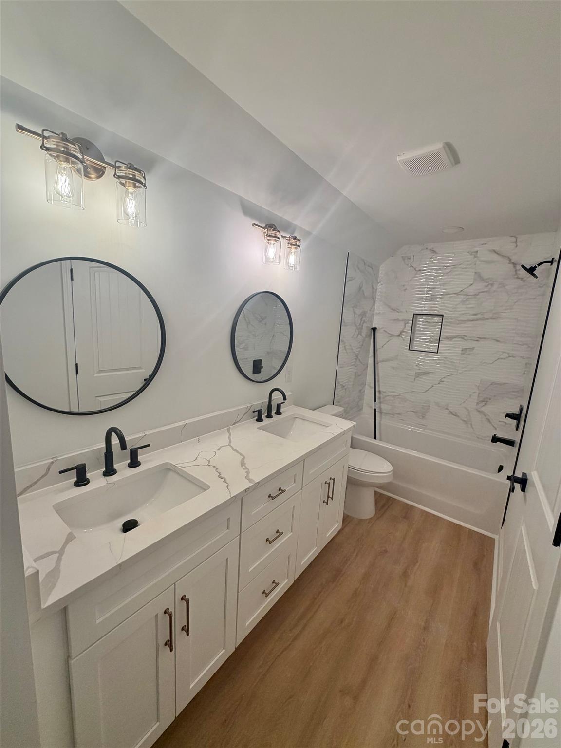 320 Blue Heron Road Salisbury, NC 28146 - Photo 17 of 22 a bathroom with a double vanity sink and a mirror