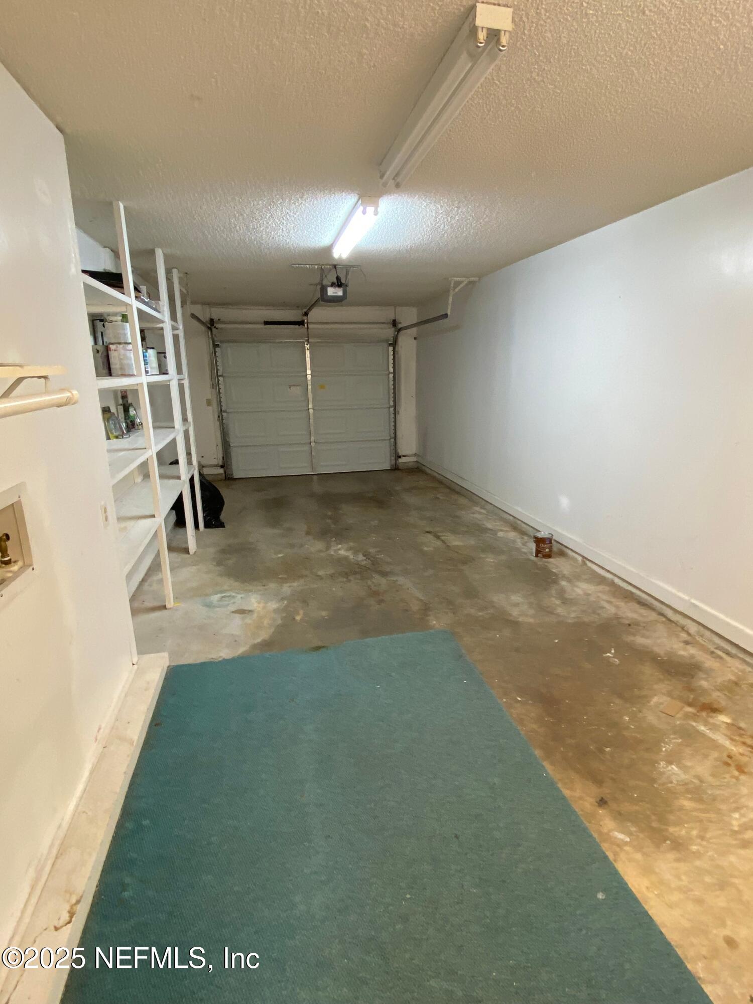 4129 Quiet Creek Loop Middleburg, FL 32068 - Photo 23 of 24 an empty room with wooden floor and windows