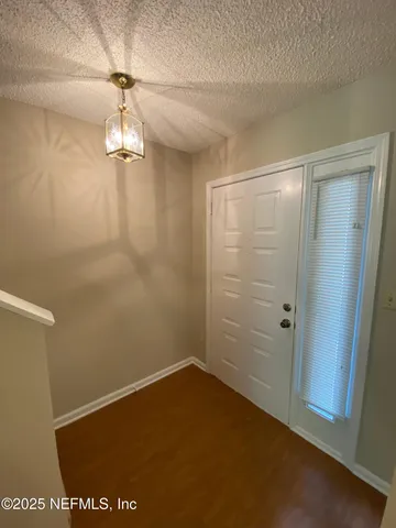 a kitchen with a stove a sink and a refrigerator