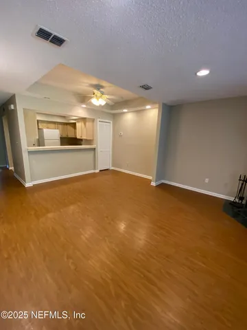 a kitchen with a sink appliances and cabinets
