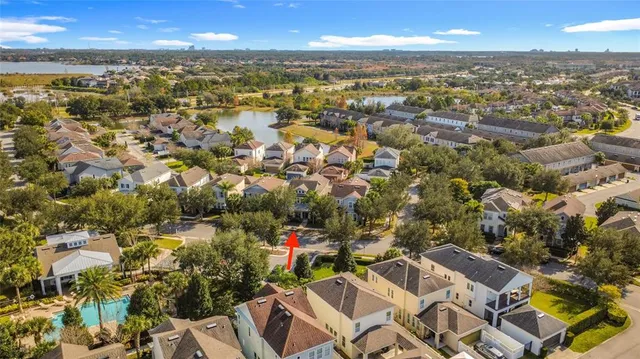 an aerial view of residential building with parking