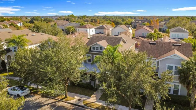 a open kitchen with stainless steel appliances granite countertop a sink a stove and a refrigerator