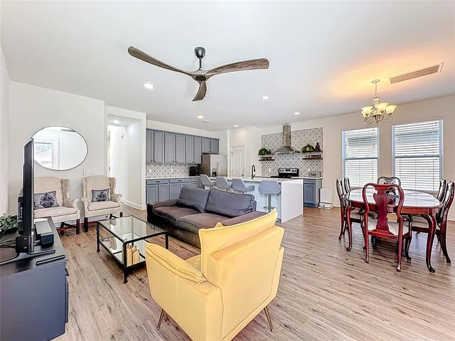 a living room with furniture or couch and a flat screen tv