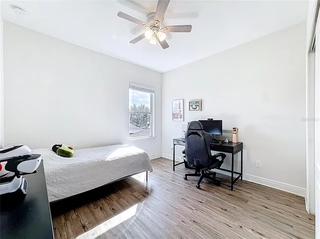 an aerial view of residential houses with city view