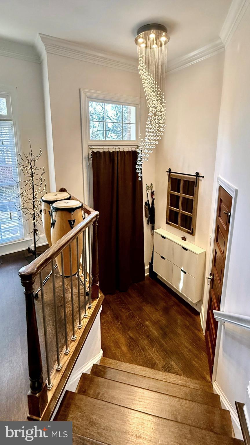 128 Rees Place Falls Church, VA 22046 - Photo 9 of 47 a view of a livingroom with furniture stairs and a chandelier