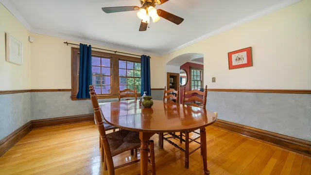 a dining room with furniture and window