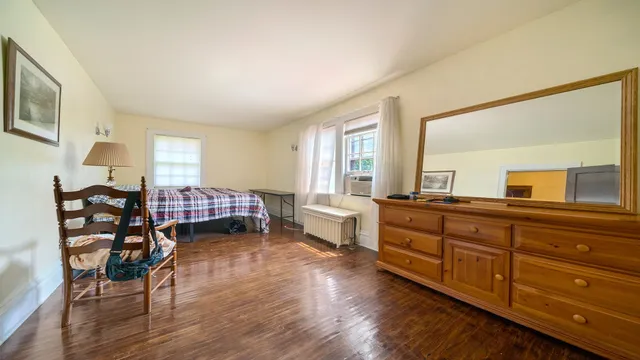 a bedroom with a bed and a desk