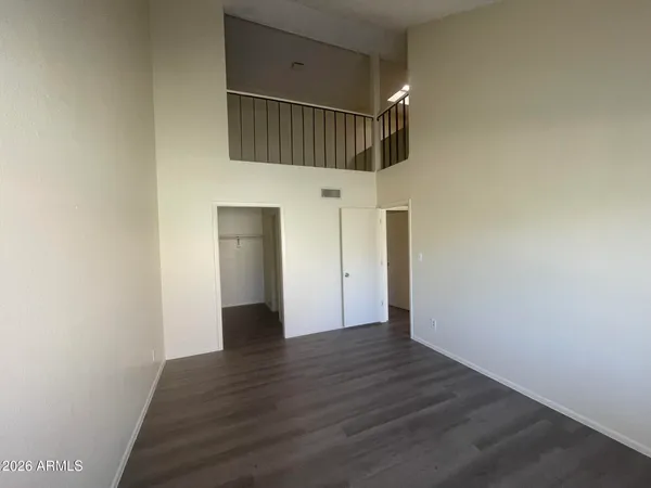 a view of hallway with wooden floor