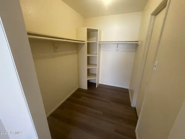 a view of an empty walk in closet