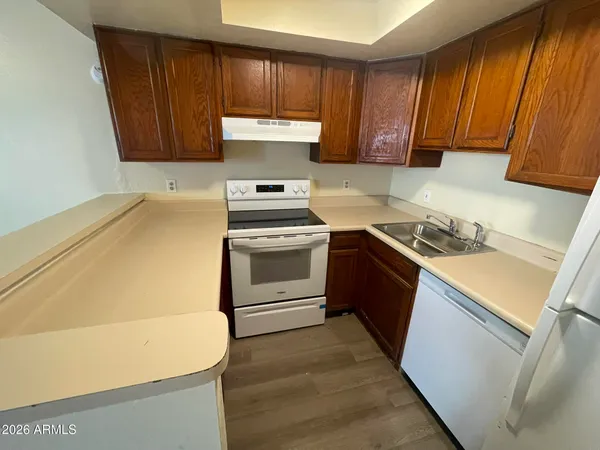 a kitchen with a stove and a sink