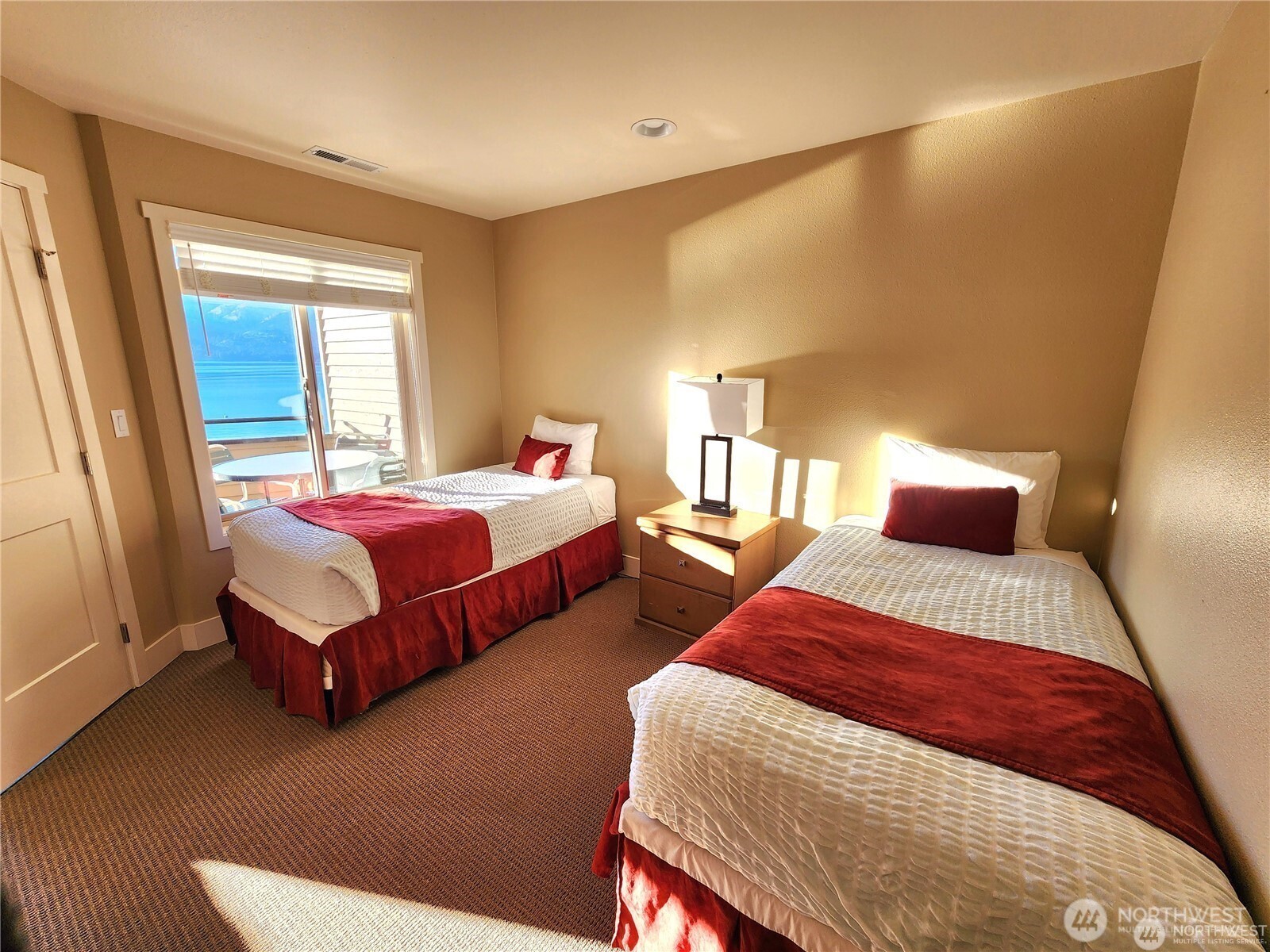 1 Lakeside 708-l Manson, WA 98831 - Photo 12 of 36 a bedroom with two beds and a couch