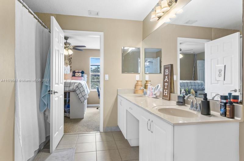 Unincorporated West Palm Beach West Palm Beach, FL 33411 - Photo 20 of 26 a kitchen with a sink and a refrigerator