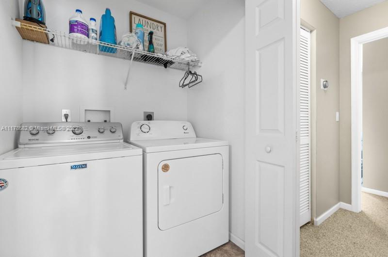 Unincorporated West Palm Beach West Palm Beach, FL 33411 - Photo 22 of 26 a utility room with dryer and washer