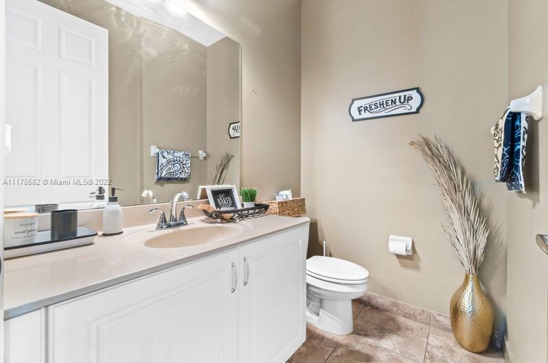 Unincorporated West Palm Beach West Palm Beach, FL 33411 - Photo 3 of 26 a bathroom with a toilet sink and mirror