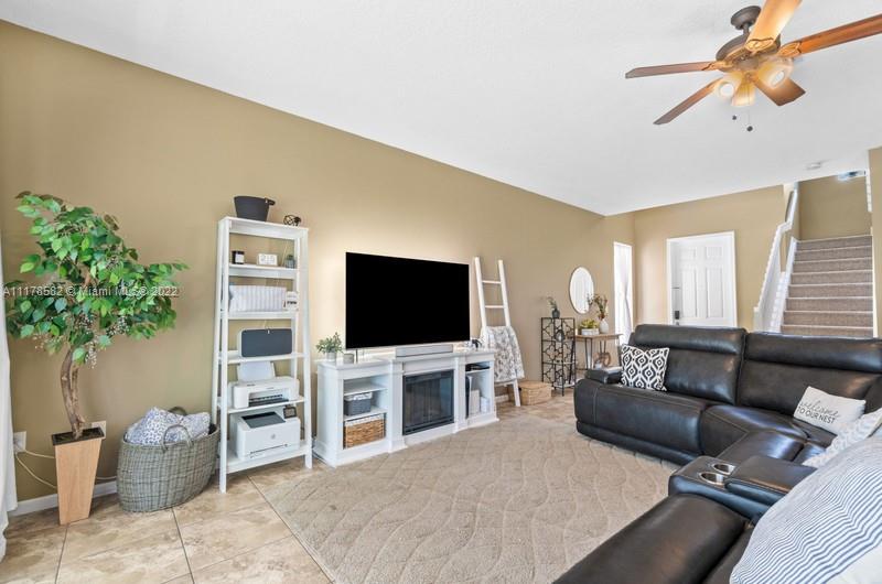 Unincorporated West Palm Beach West Palm Beach, FL 33411 - Photo 6 of 26 a living room with furniture and a flat screen tv