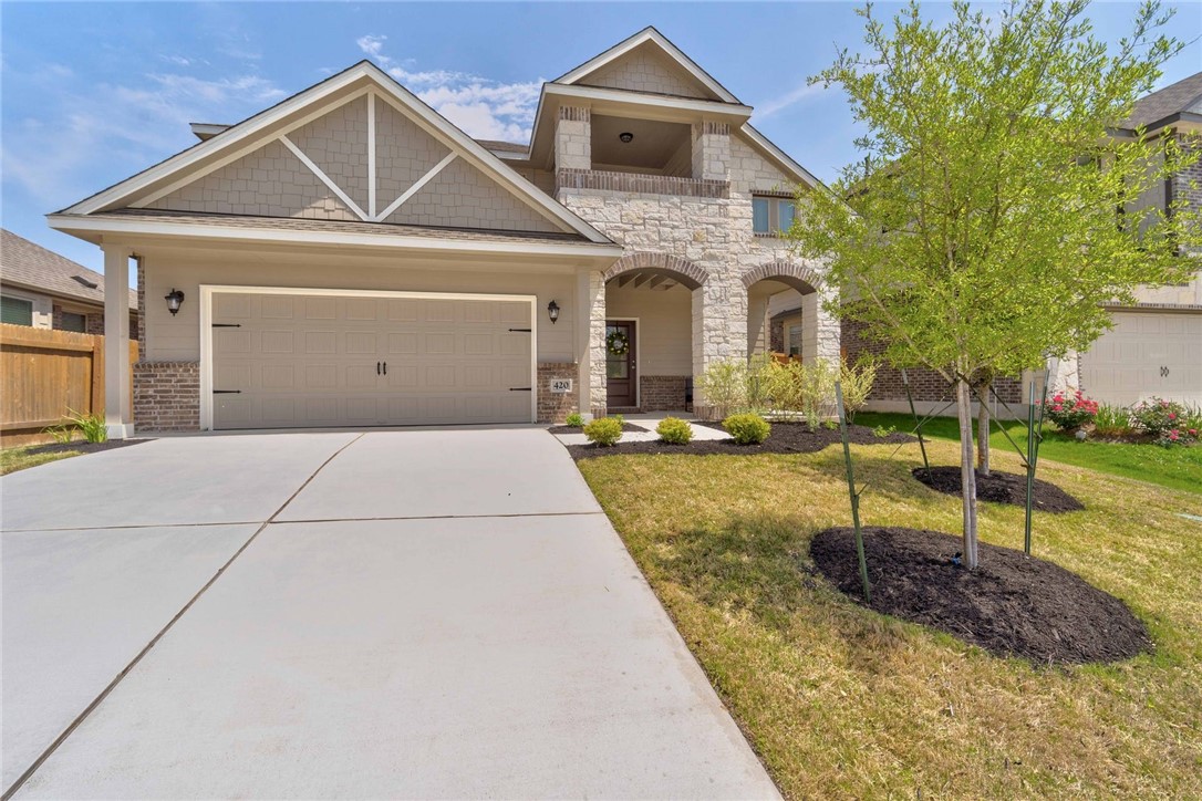 420 Nautical Loop Kyle, TX 78640 - Photo 1 of 1 a front view of a house with garden