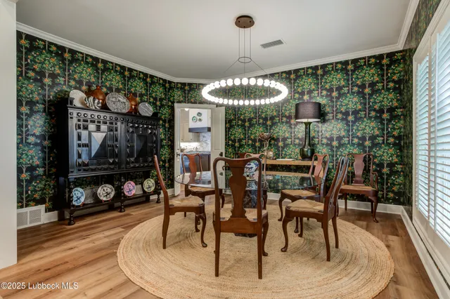 a kitchen with stainless steel appliances granite countertop a sink and a stove
