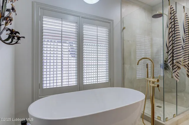 a living room with furniture and a desk