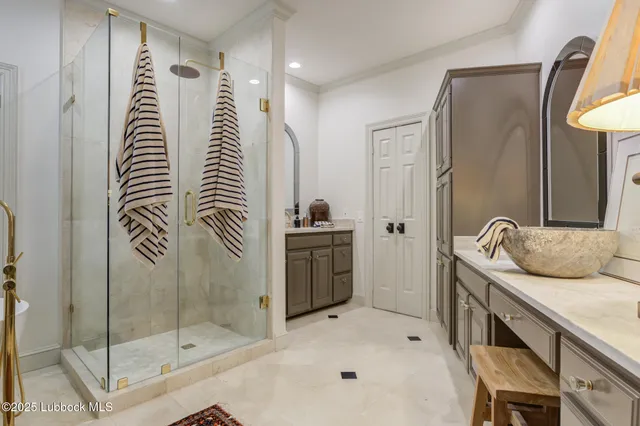 a bathroom with a granite countertop sink and a toilet
